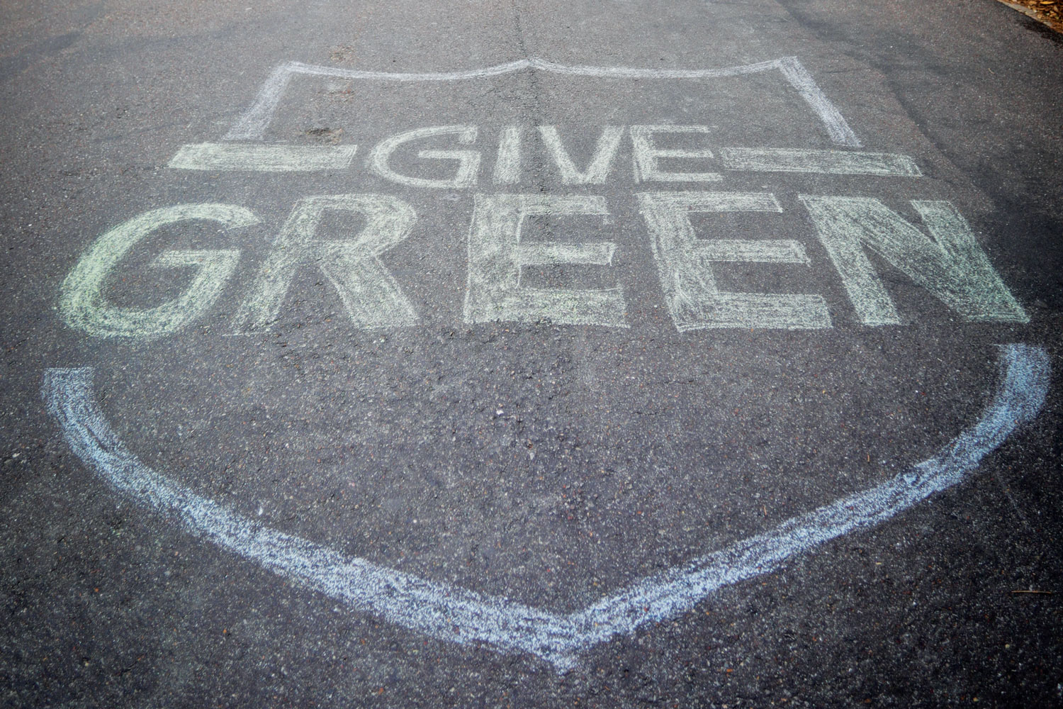 Give Green 2019 written in sidewalk chalk