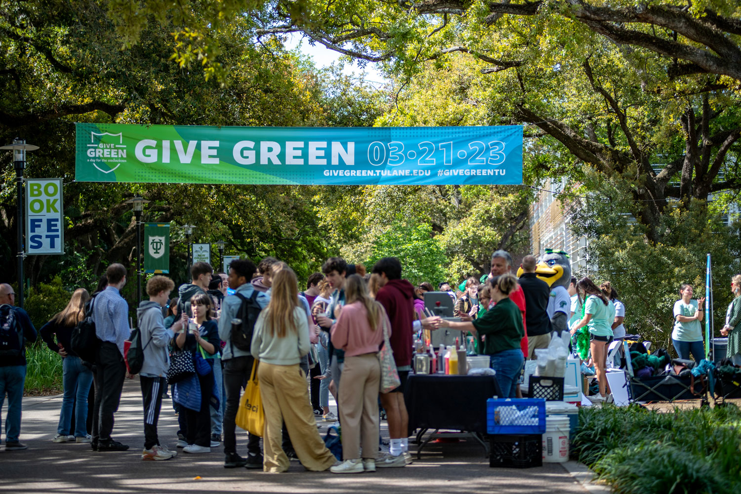 Give Green crowd under banner