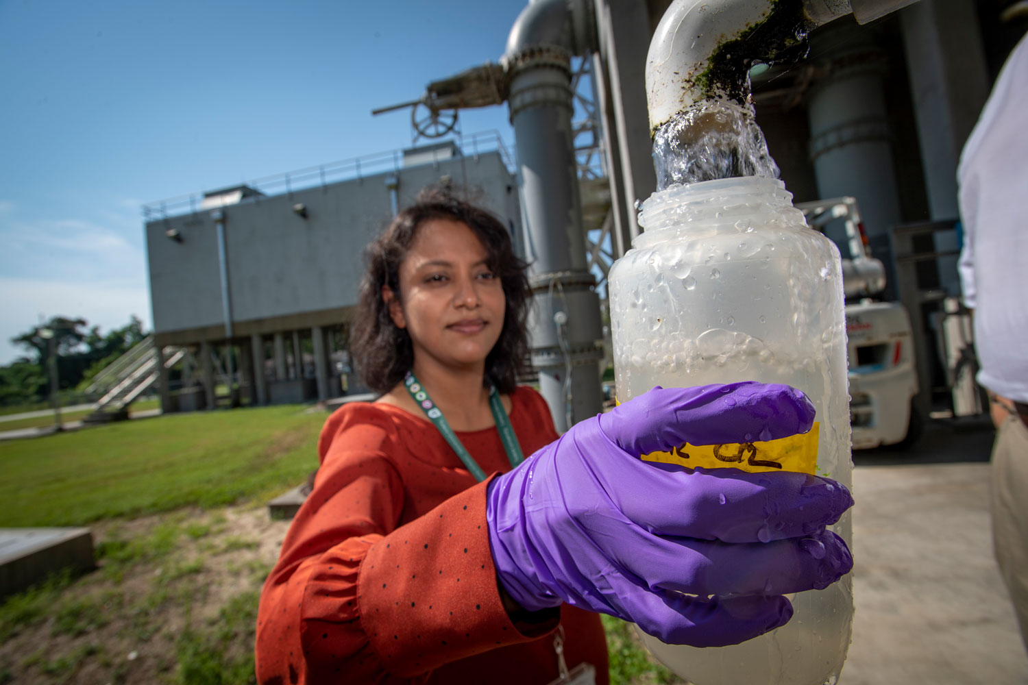 Woman filling a bottle with water